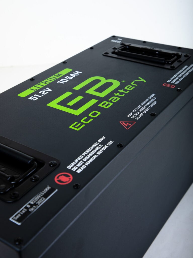 Black lithium battery with green writing, angled view